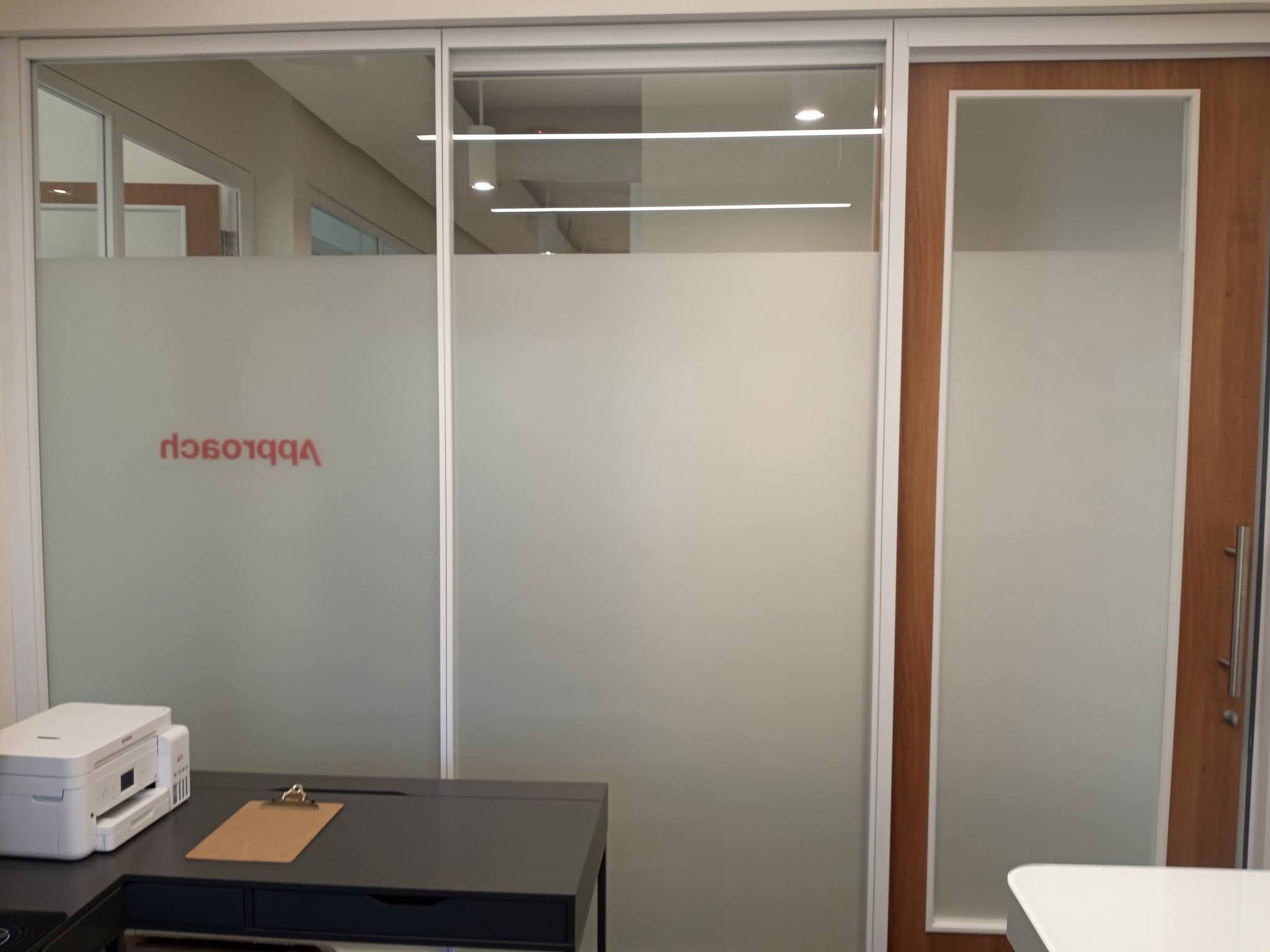 Commercial decorative window film installation in Vestavia before completion