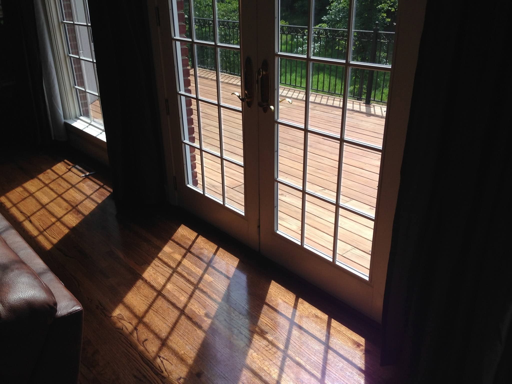 Sunlit French doors overlooking a wooden deck at the Liberty Park home