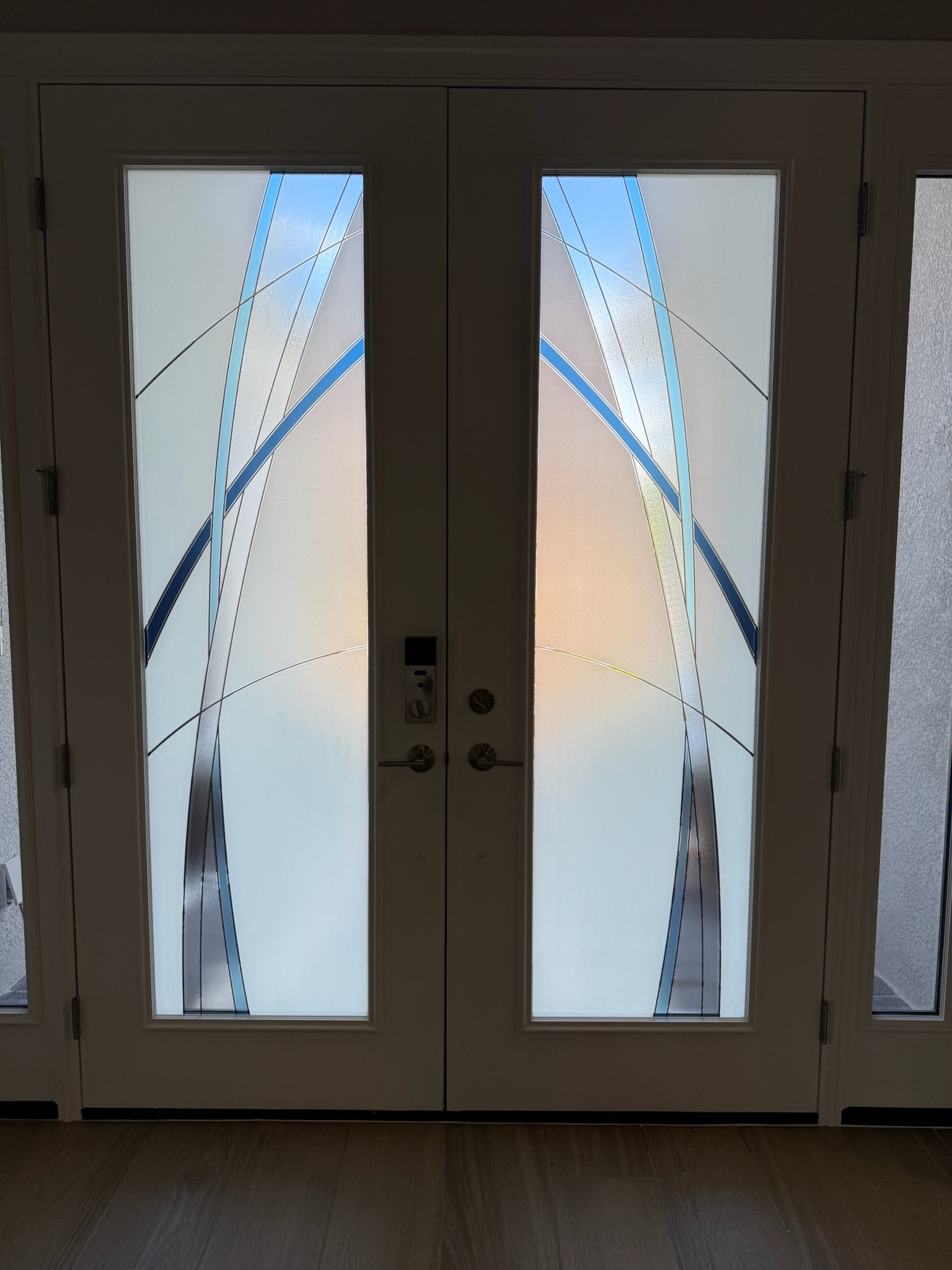 Decorative glass film panels installed on double front doors